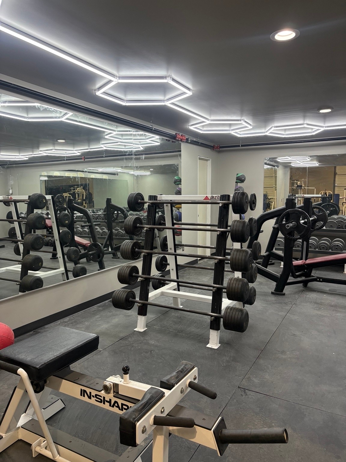 Club 72 gym floor with barbell racks